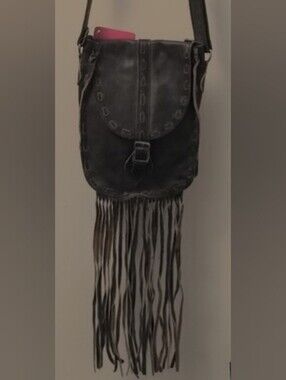 Women's Brown Fringe Leather Crossbody Bag with Magnetic Closure.